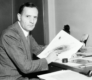 Portrait of Edwin Hubble with his image of M31