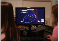 Students at a computer using WWT