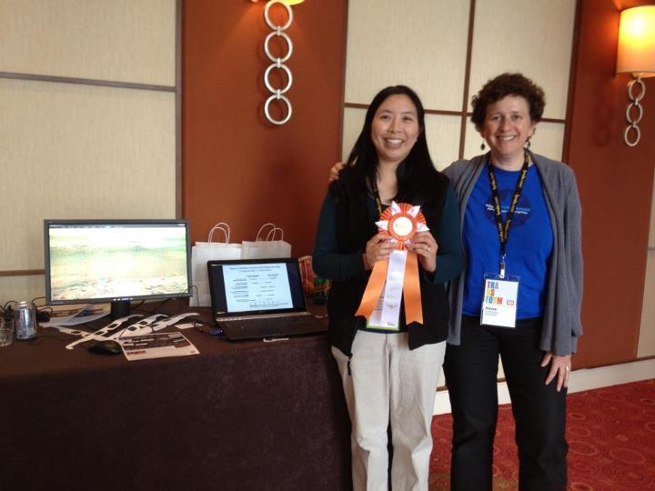 Patricia Udomprasert and Alyssa Goodman accepting WWTA's blue ribbon.